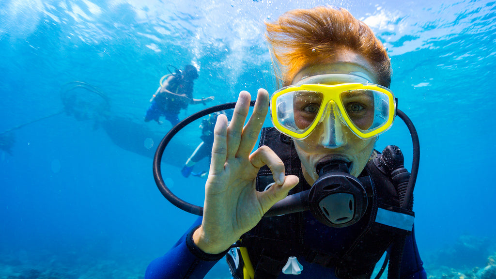 a new scuba diver giving the ok sign